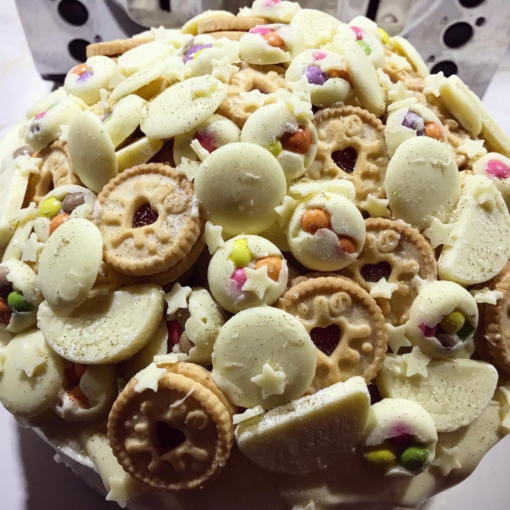 White chocolate raspberry cake (because it's his favourite) topped with a heck of a lot of white chocolate!